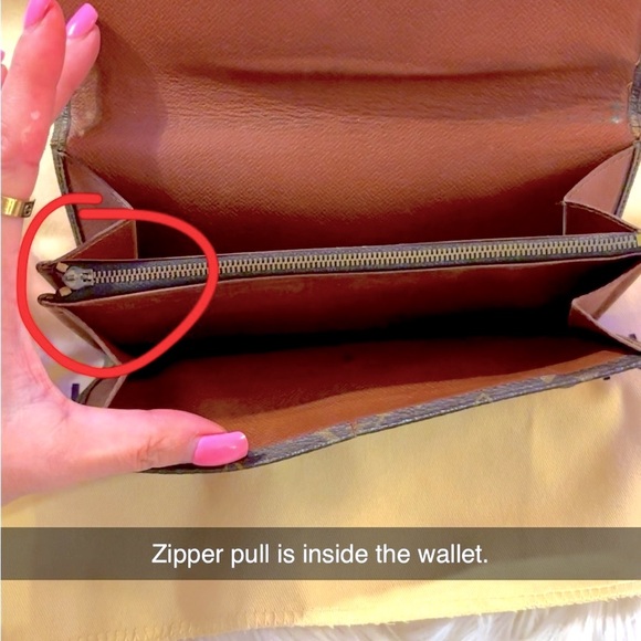 LV Sarah wallet, the call out is the zipper pull is not attached.